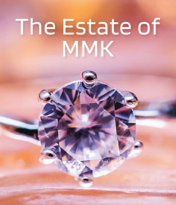 Close-up of a diamond ring with the text "The Estate of MMK" above it, reflecting the timeless elegance often involved in wills Singapore.